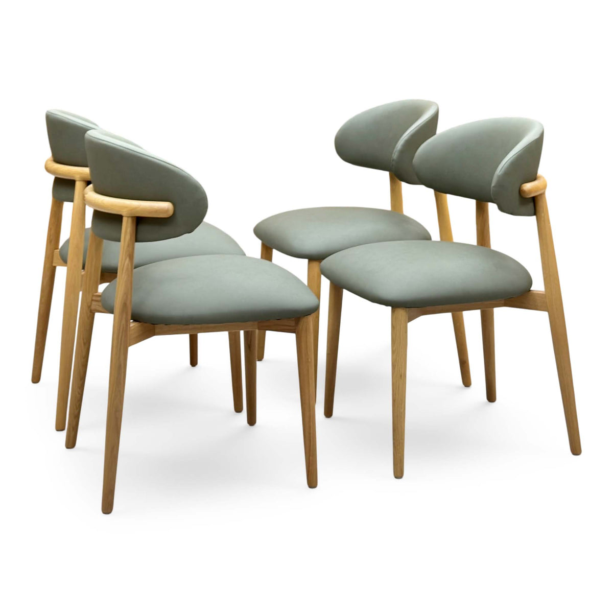 Riga olive green faux leather dining chairs angled from the left showing the curved oak back rails
