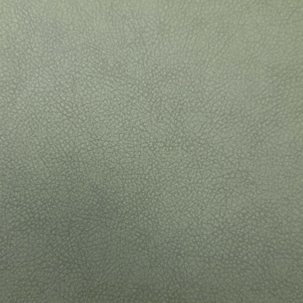 Close-up of the olive green faux leather used on the Riga dining chairs