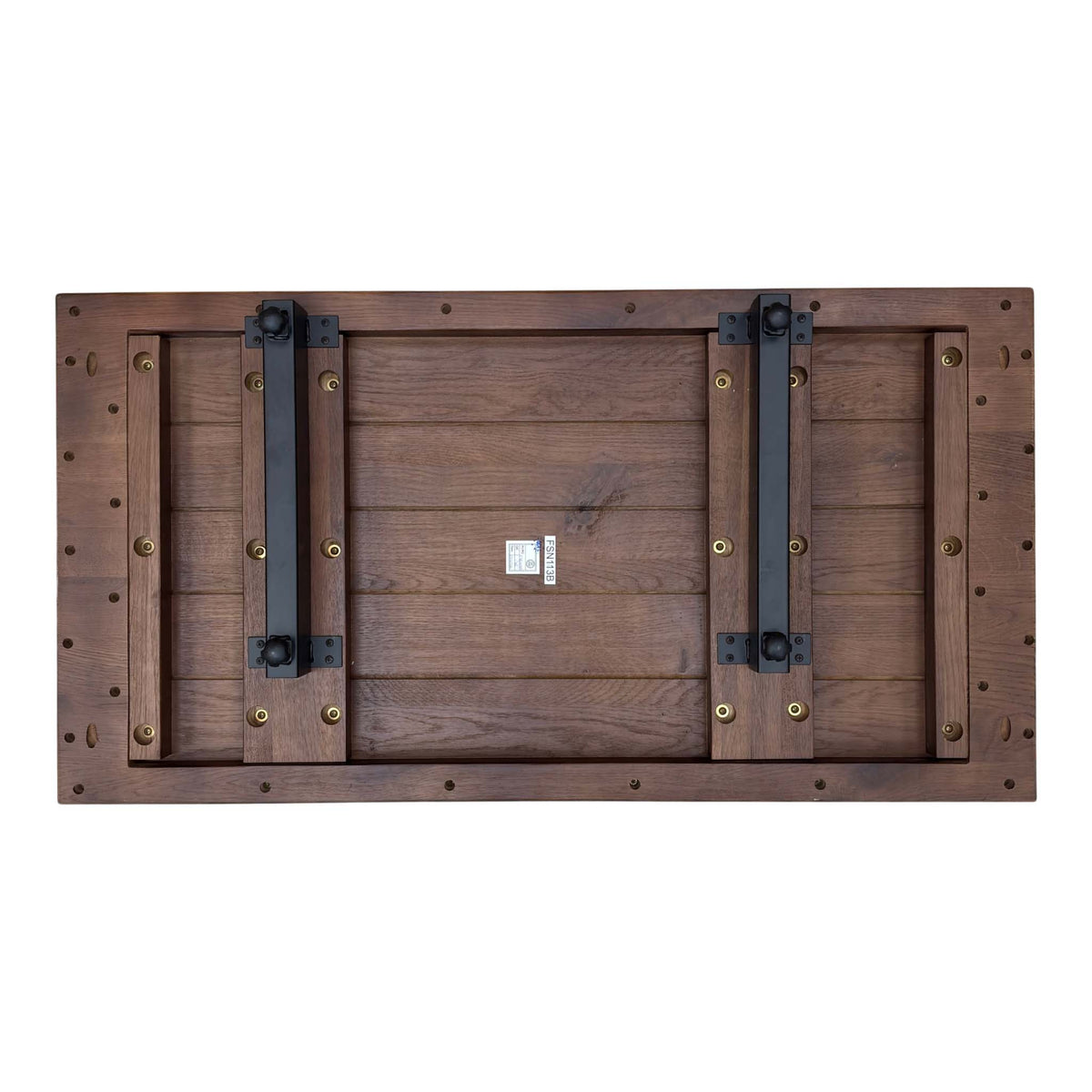 Underside of the Mars dark oak extension leaf showing two black metal rails and brass bolts