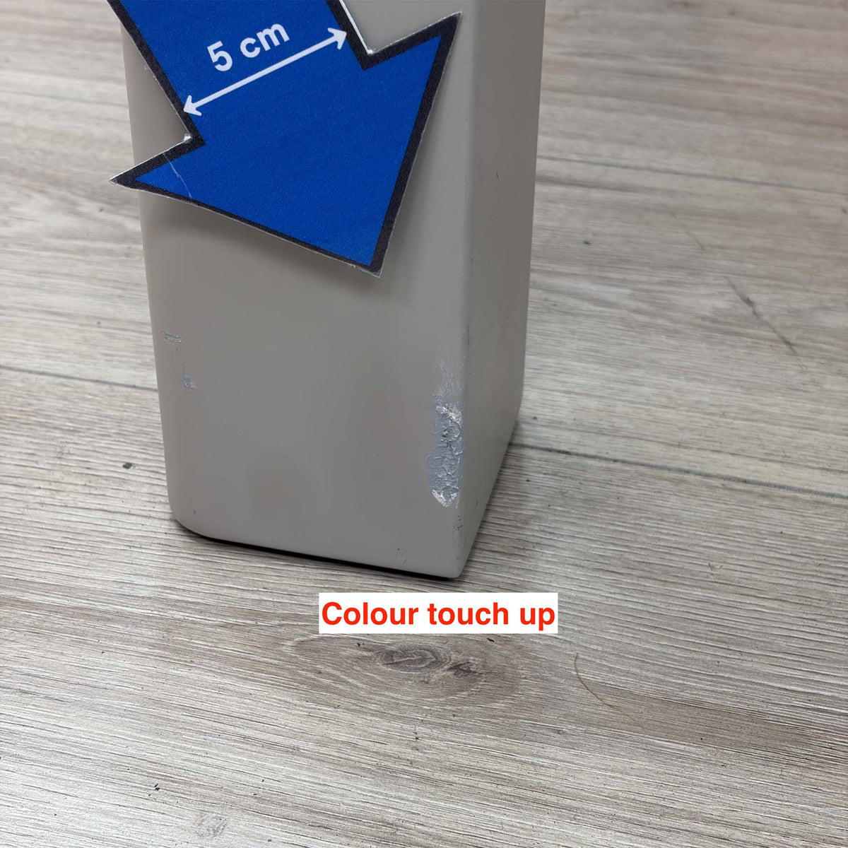Close-up of the colour touch-up on a leg of the Lewis dining table