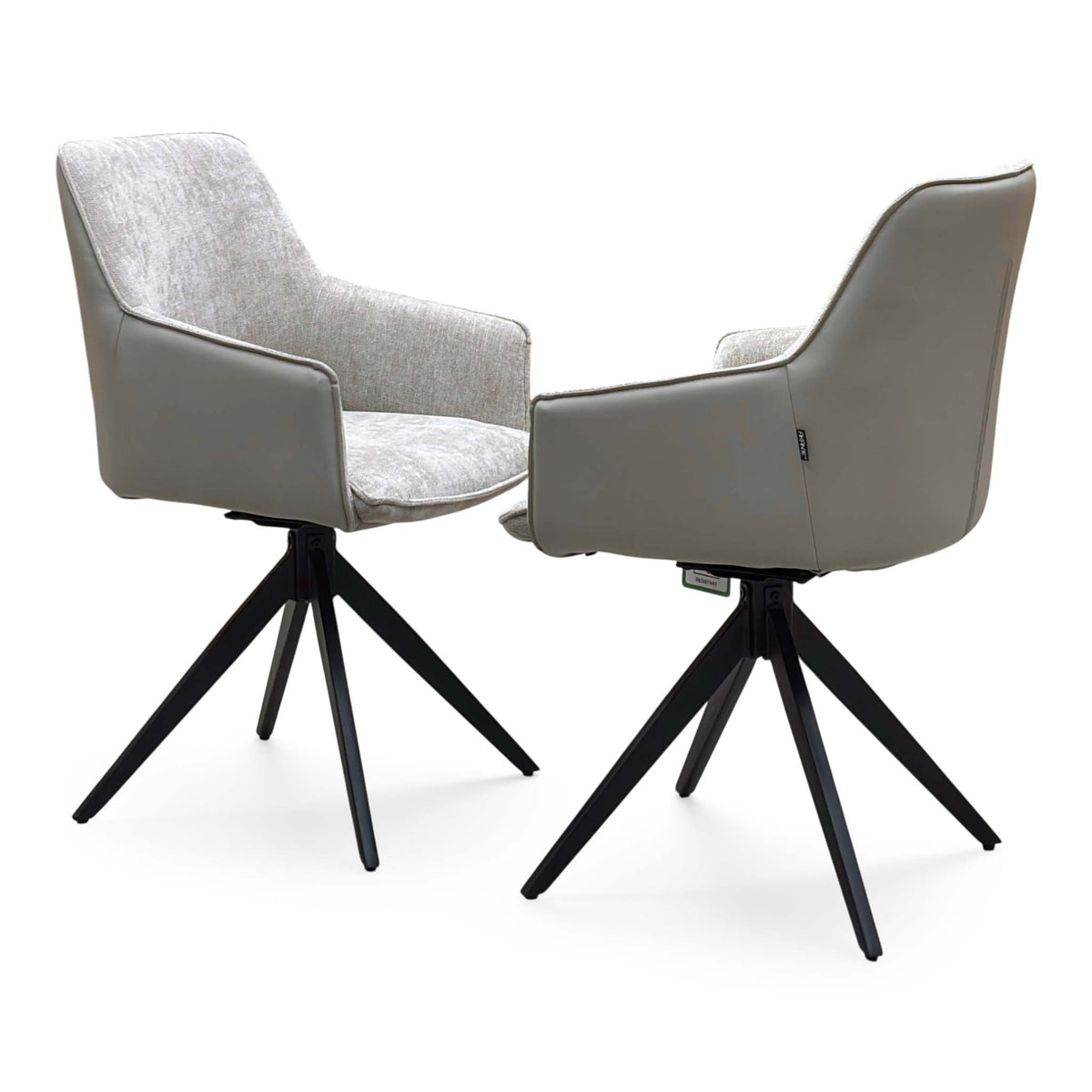 Pair of Jose cream fabric swivel dining chairs angled, one from the front and one from behind