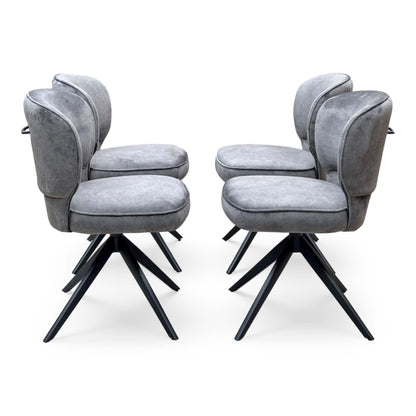 Side profiles of the four Imperium mink velvet swivel dining chairs in two facing pairs