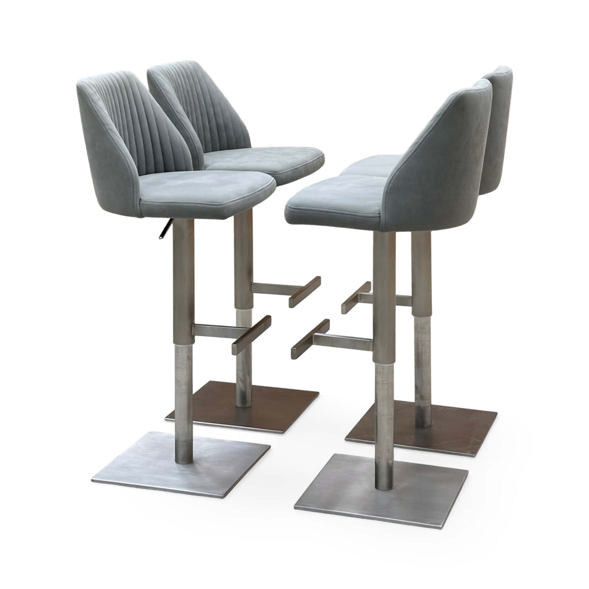 Front angle of the Grigio grey fabric set of 4 bar stools with channel-stitched backs and footrests