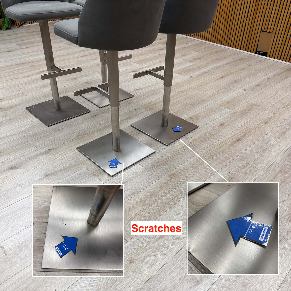 Grigio bar stool bases with scratches marked by arrows, with two inset close-ups of the marks