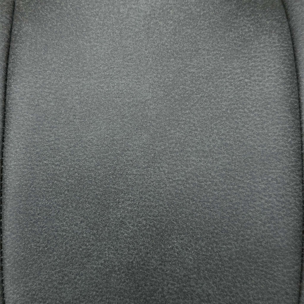 Close-up of the charcoal grey faux leather with contrast stitching used on the Germain dining chairs