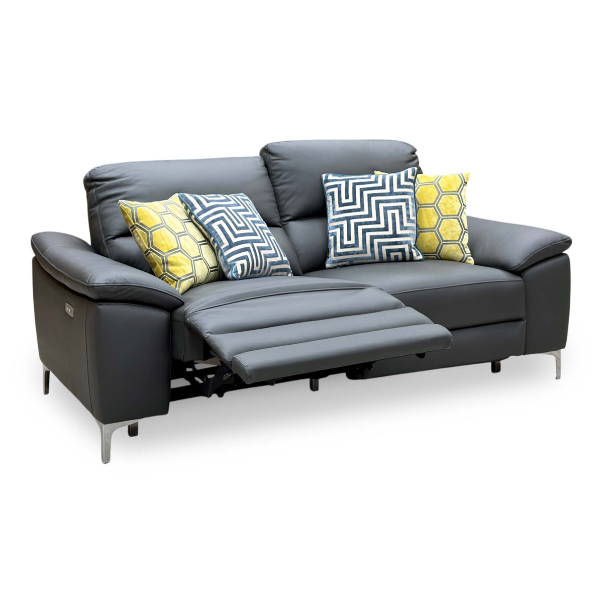 Pavillion charcoal grey leather 3 seater power recliner sofa with one seat reclined, angled view with patterned cushions