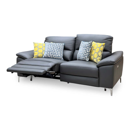 Pavillion charcoal grey leather power recliner sofa with the left seat reclined and footrest raised, angled from the right