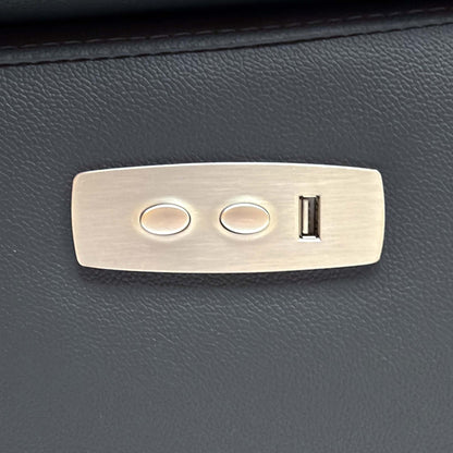 Close-up of the power recline control panel with two buttons and a USB port on the Pavillion sofa arm