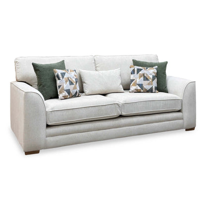 Kaluna natural fabric 3 seater sofa, angled cut-out with green and geometric patterned scatter cushions