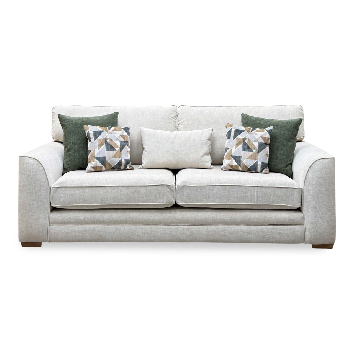Front view of the Kaluna natural fabric 3 seater sofa with green and patterned cushions
