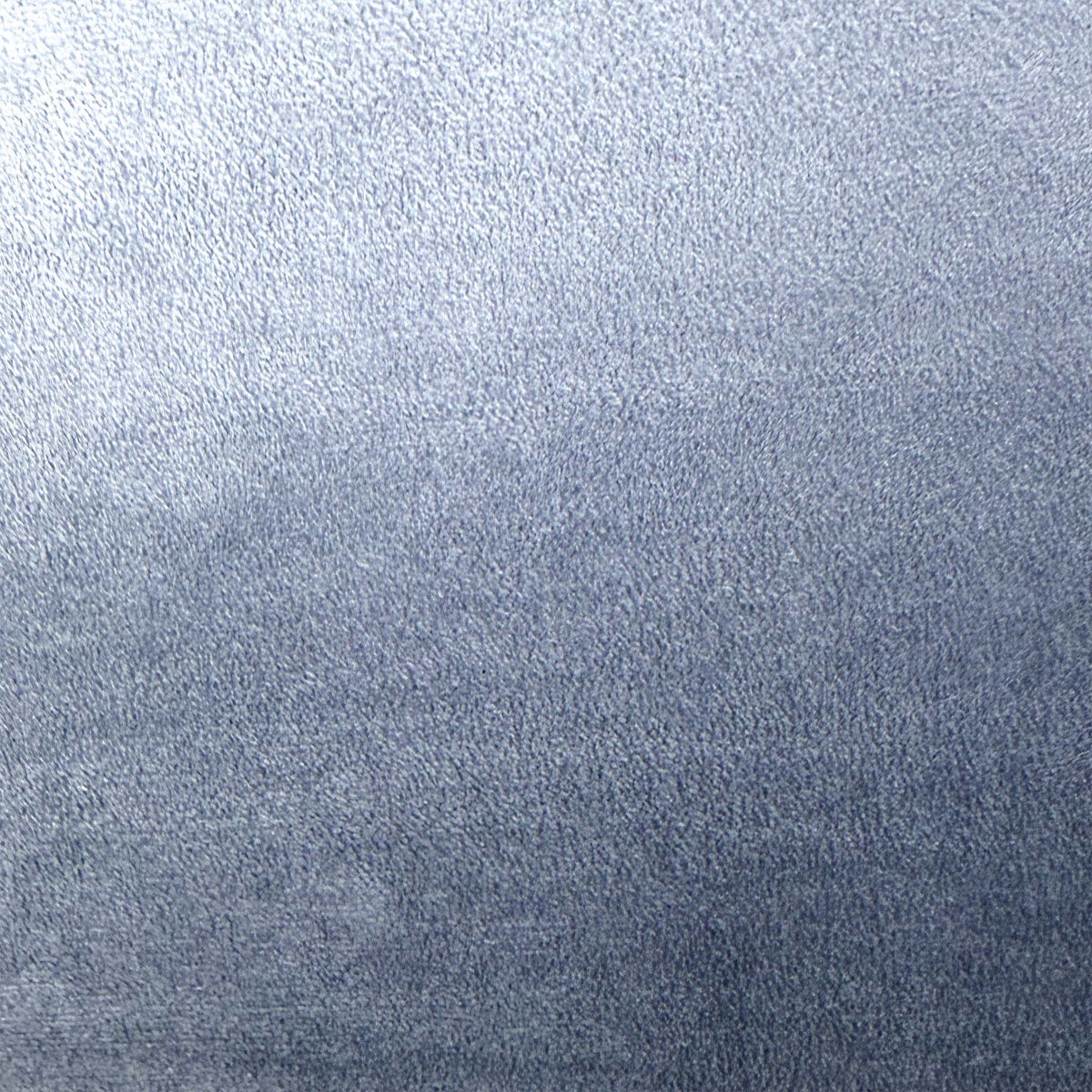 Close-up of the bluish grey velvet fabric used on the Cali accent chair