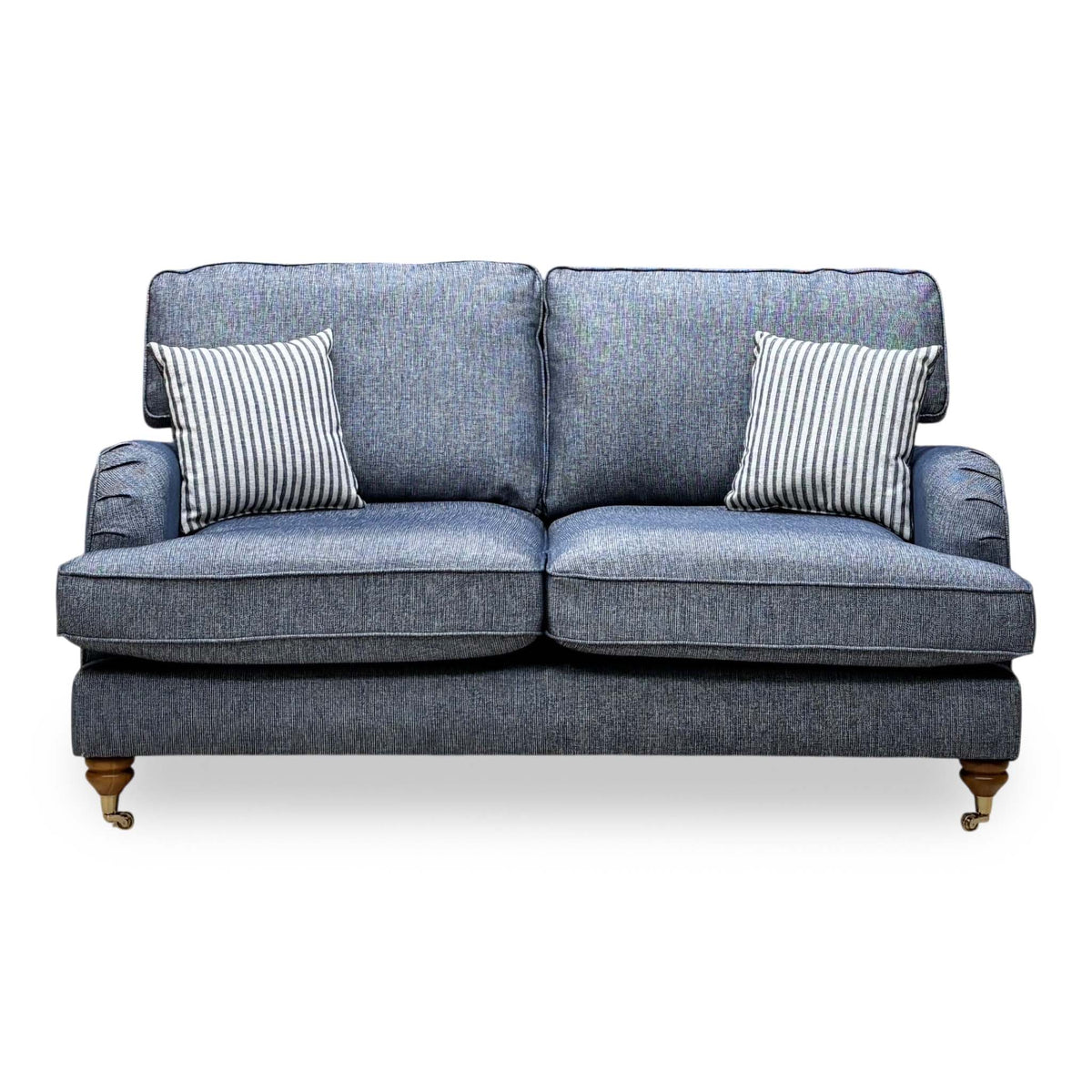 Front view of the Bay navy blue plain fabric 2 seater sofa with two striped cushions and pleated arms
