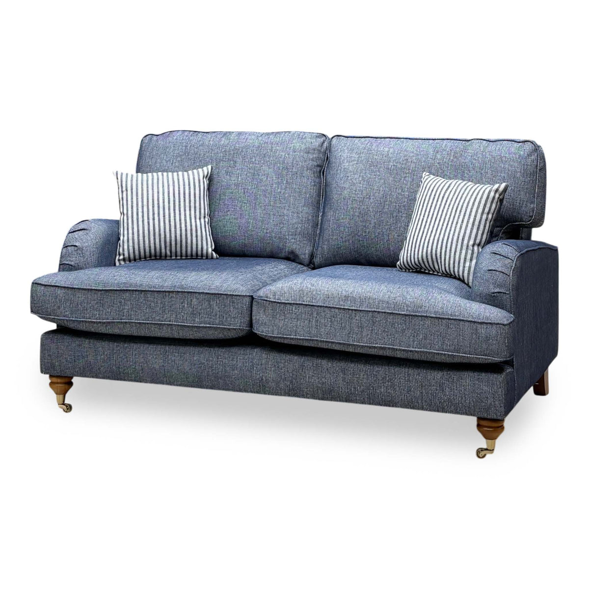 Bay navy blue plain fabric 2 seater sofa, angled view from the right showing the brass castor feet
