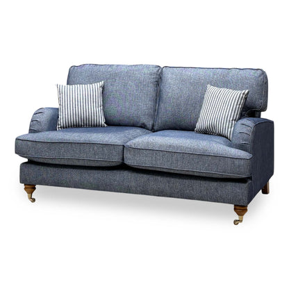 Bay navy blue plain fabric 2 seater sofa, angled view from the right showing the brass castor feet