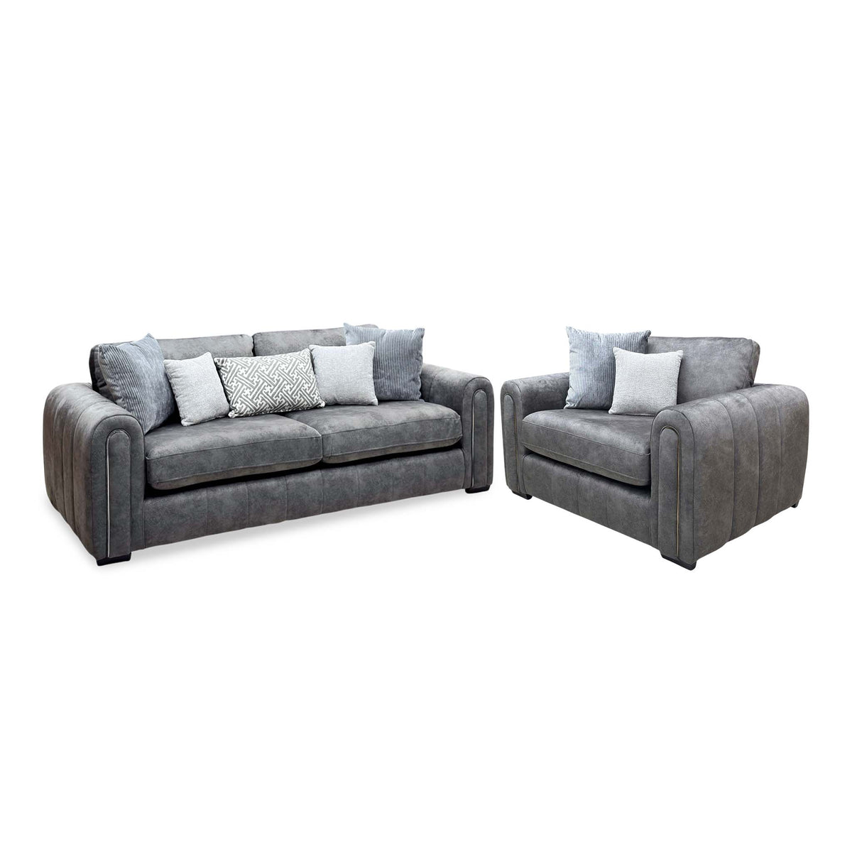 Amara charcoal grey velvet 3 seater sofa and snuggle chair with scatter cushions, angled view with the sofa on the left