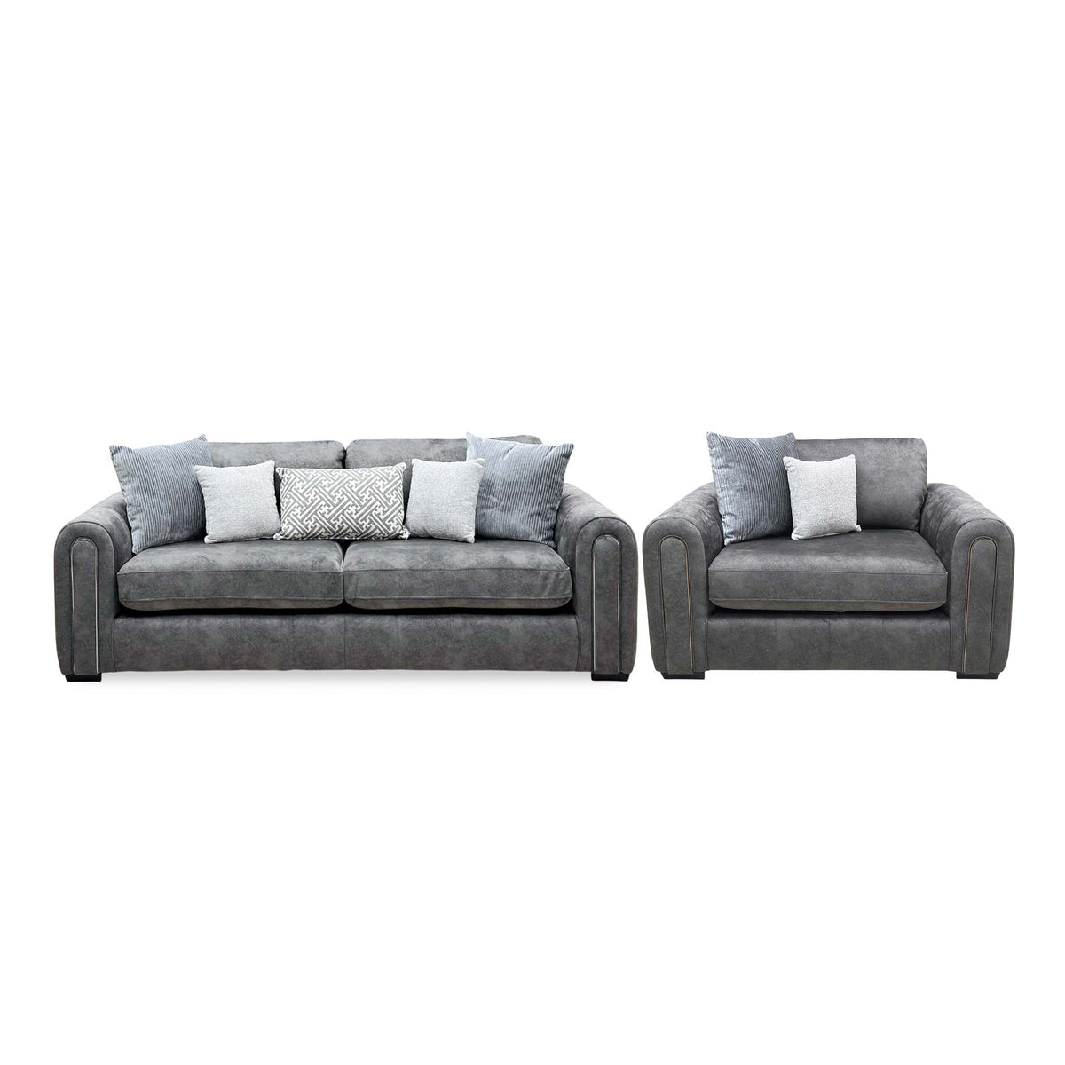 Front view of the Amara charcoal grey velvet 3 seater sofa and snuggle chair with grey and patterned scatter cushions