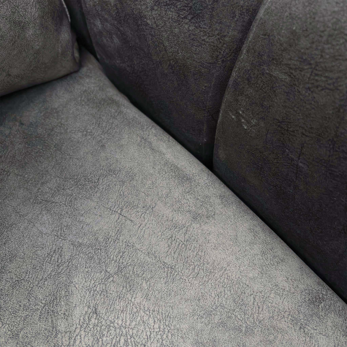 Close-up of the seat and back cushions on the Amara charcoal grey velvet sofa