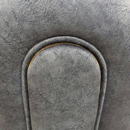 Close-up of the rolled arm panel with piped trim on the Amara charcoal grey velvet sofa