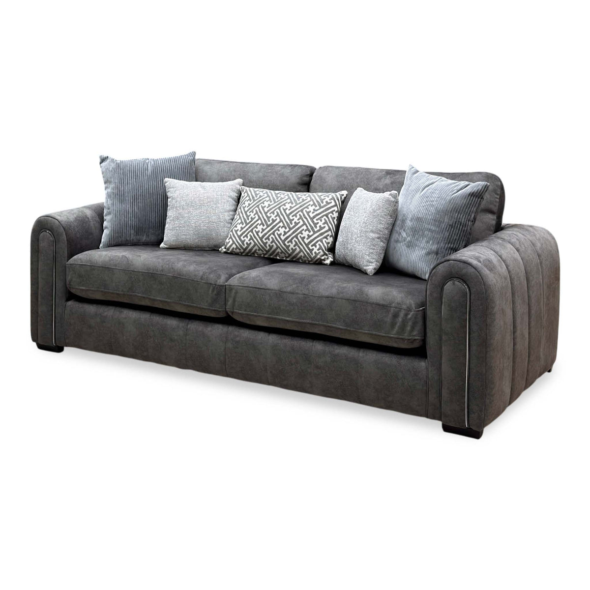 Amara charcoal grey velvet 3 seater sofa, angled view from the right showing the piped arm detail