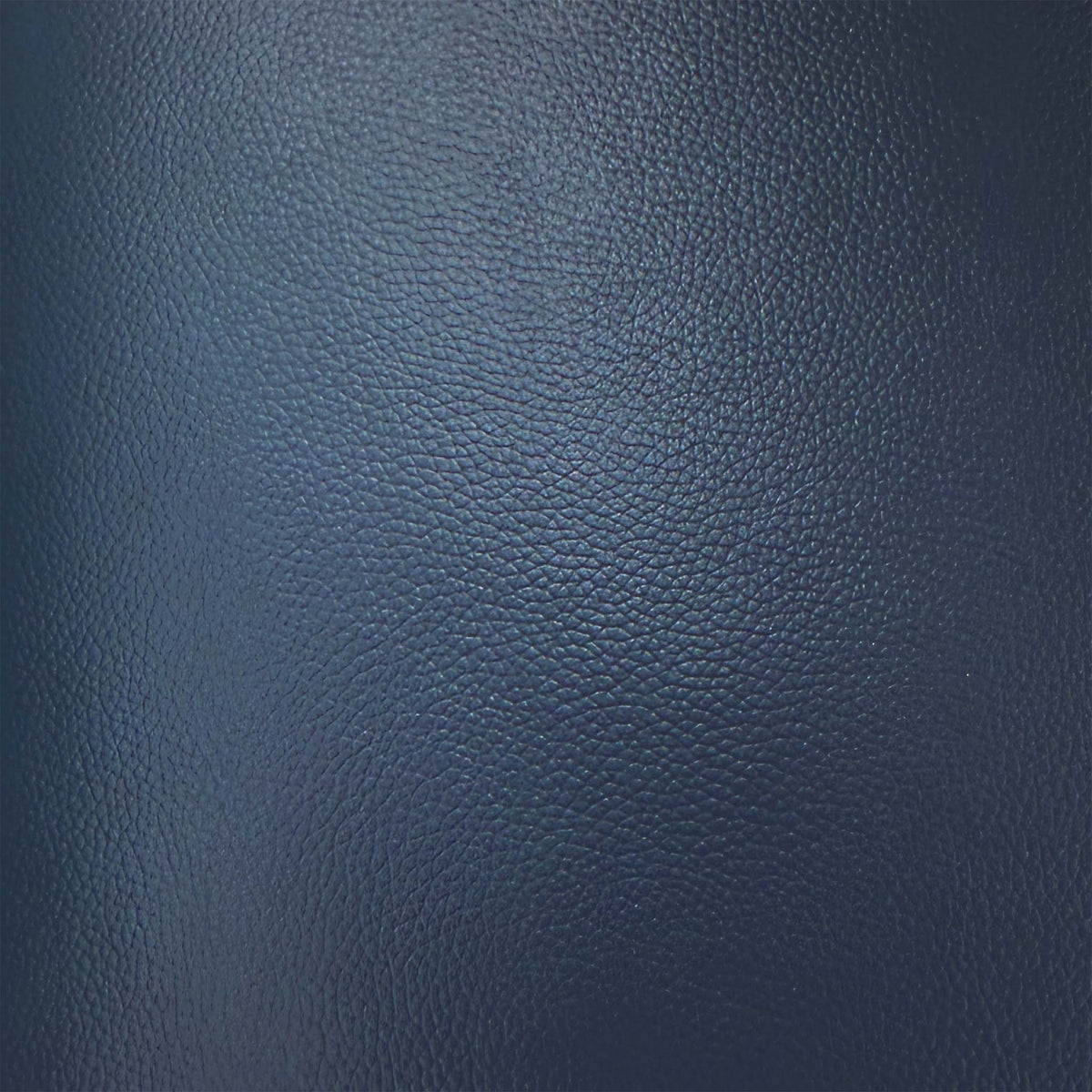 Close-up of the ocean blue grained leather used on the World of Leather Touch storage footstool