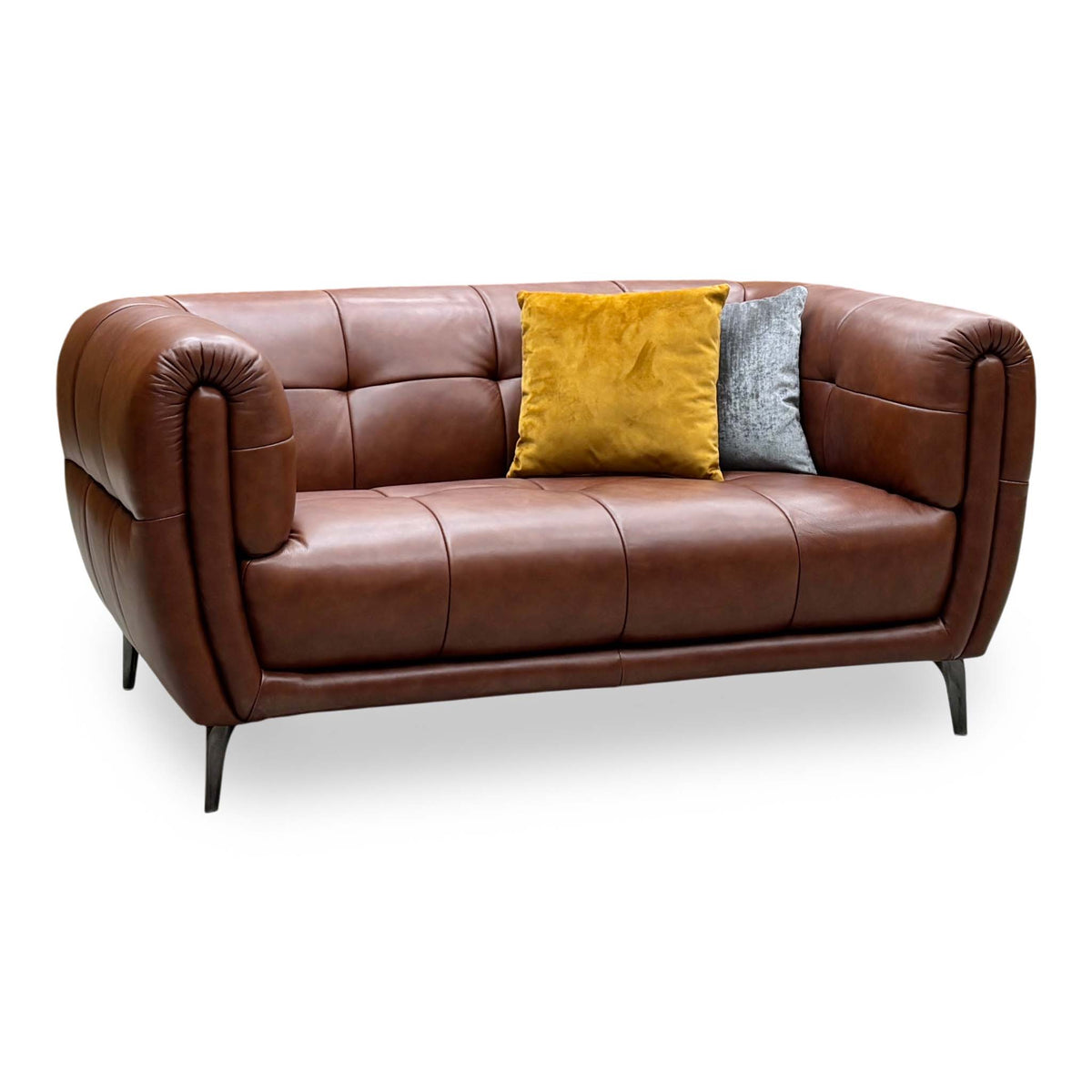Ideal Home Sienna butterscotch brown leather 2 seater sofa, angled view with yellow and grey cushions