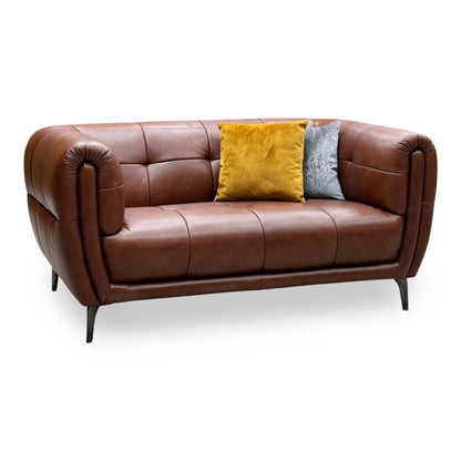 Ideal Home Sienna butterscotch brown leather 2 seater sofa, angled view with yellow and grey cushions