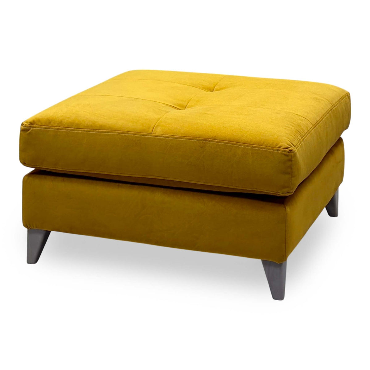 The Lounge Co. Hermione amber yellow velvet footstool with a buttoned top, angled view from the right