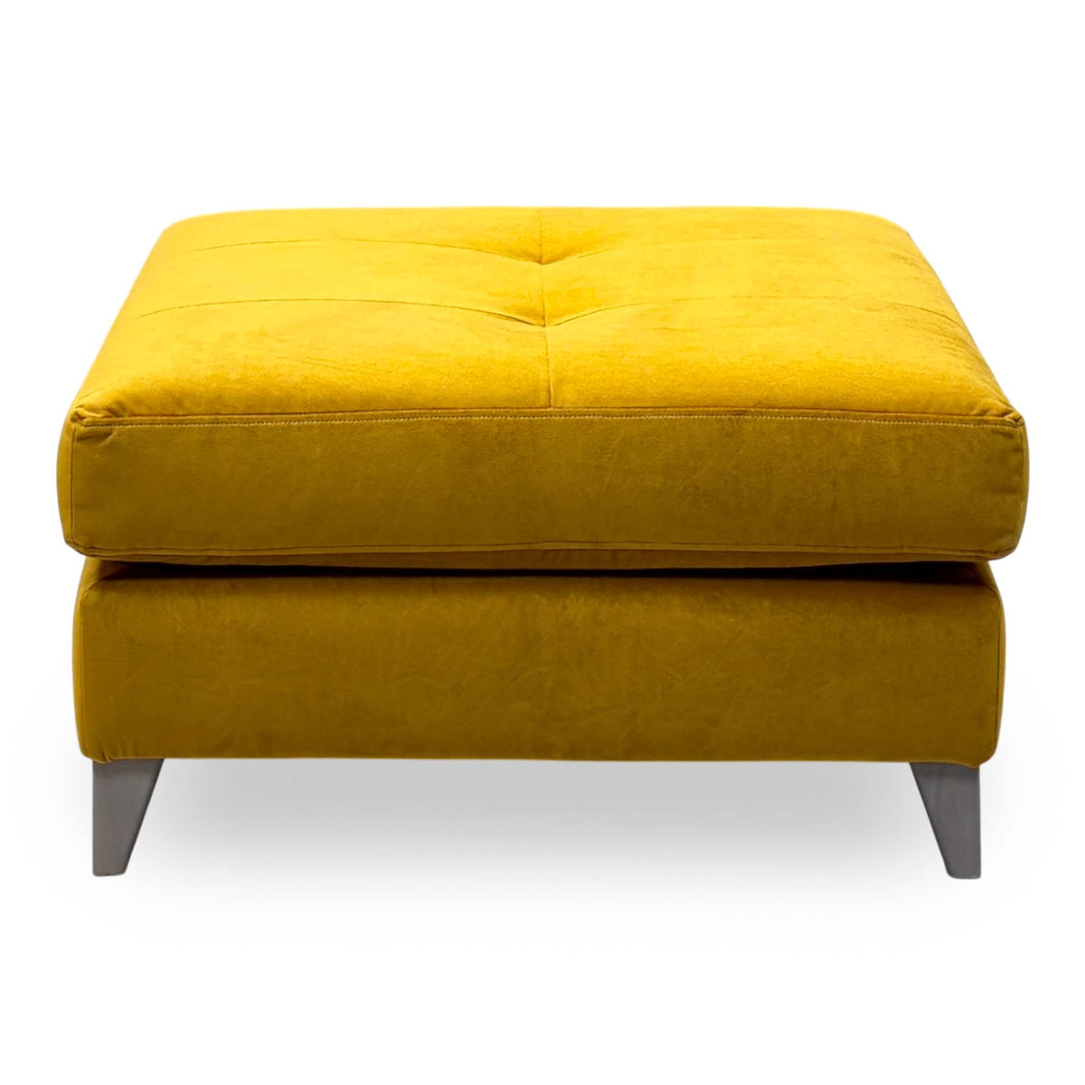 Front view of The Lounge Co. Hermione amber yellow velvet footstool showing the grey tapered legs
