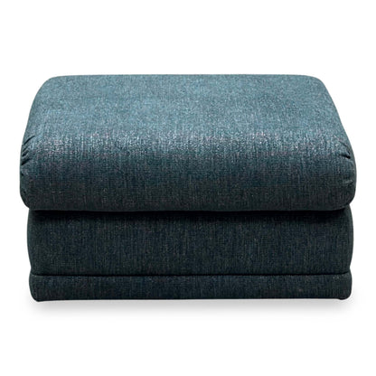 Front view of the G Plan Malvern teal fabric storage footstool with the lid closed