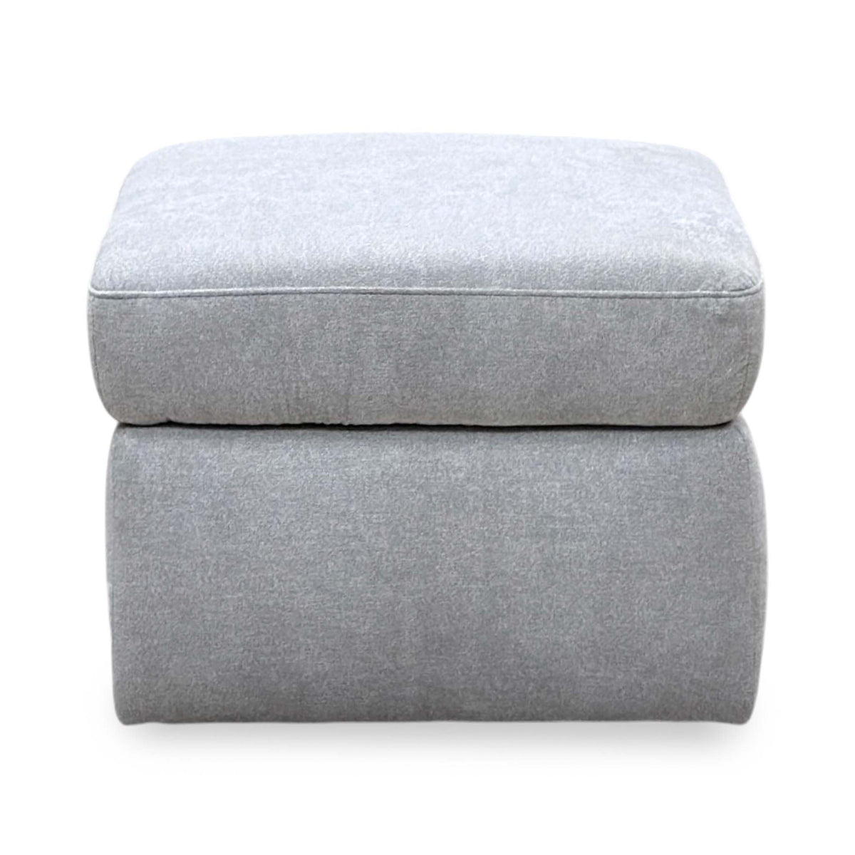 Front view of the Berlin rosy light grey fabric storage footstool with its lid closed