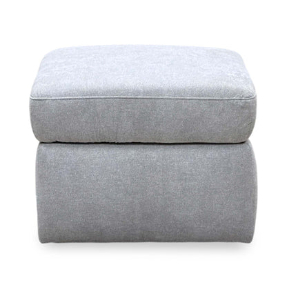 Front view of the Berlin rosy light grey fabric storage footstool with its lid closed