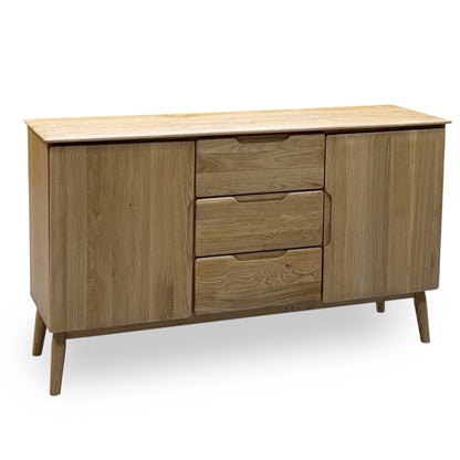 Stockholm light oak solid oak 2 door 3 drawer large sideboard, angled view on tapered legs