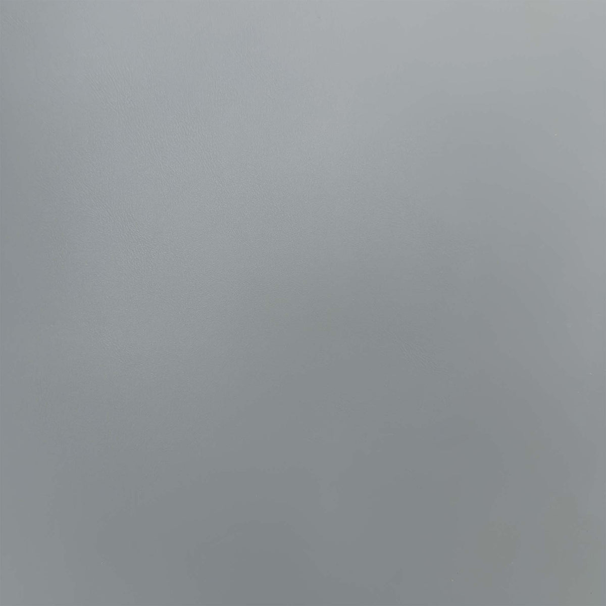 Close-up of the stone grey faux leather used on the Quattro swivel dining chairs