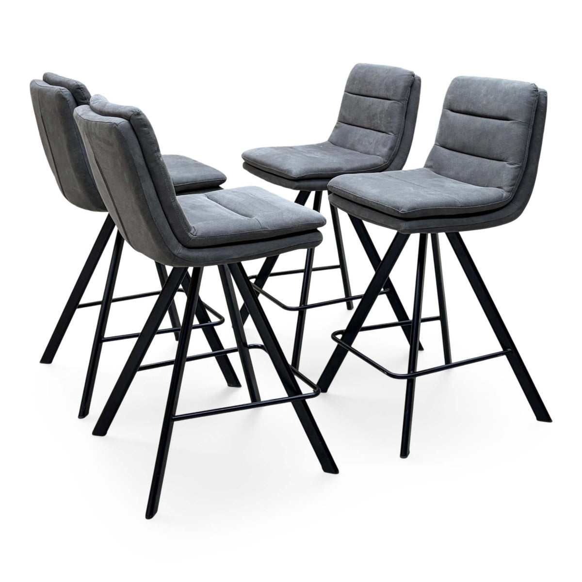 Bodahl Njord anthracite grey fabric bar stools angled from the right showing the stitched seat panels and footrests