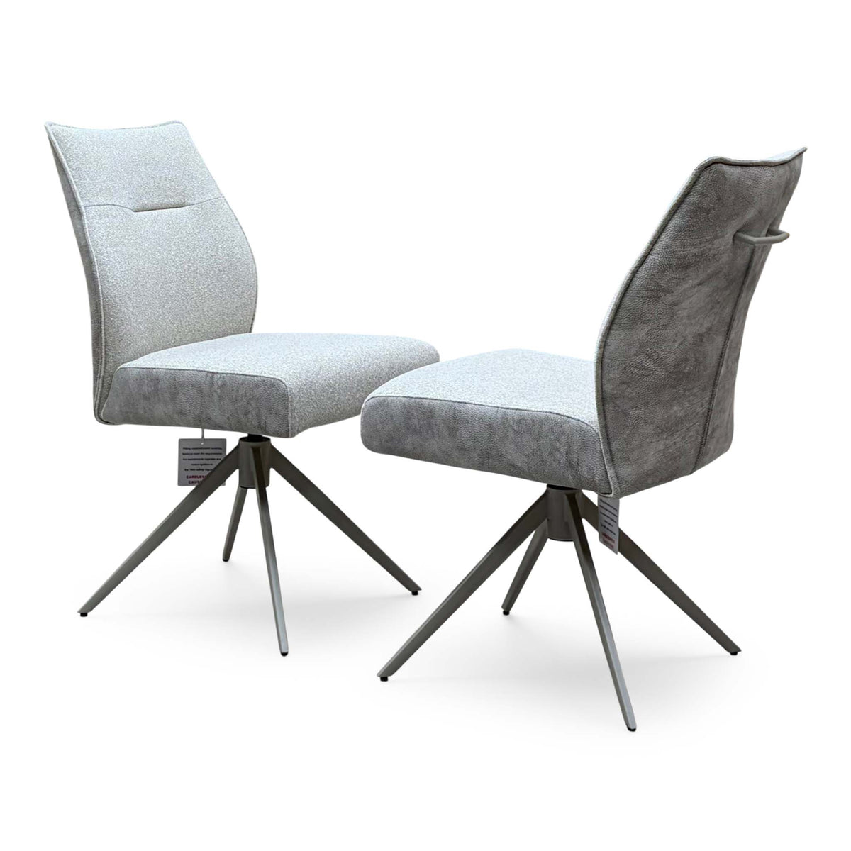 Mirage neutral fabric armless swivel dining chairs, angled view with the grey suede effect back and handle