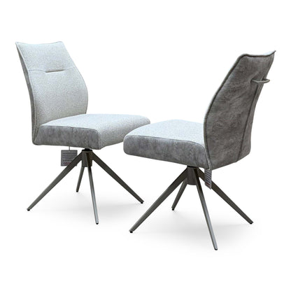 Mirage neutral fabric armless swivel dining chairs, angled view with the grey suede effect back and handle