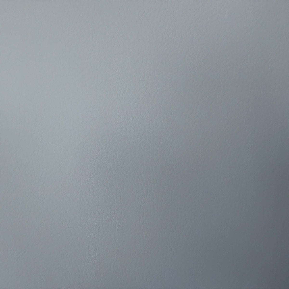Close-up of the grey faux leather used on the Fumo cantilever dining chairs