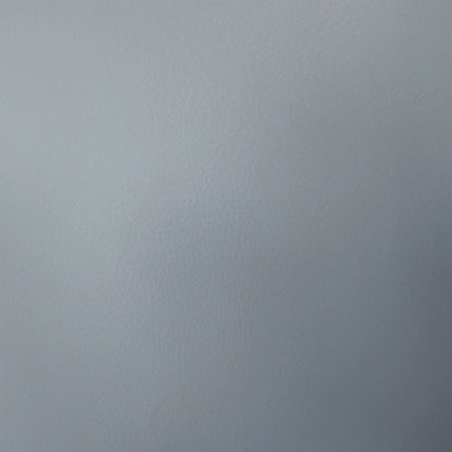 Close-up of the grey faux leather used on the Fumo cantilever dining chairs