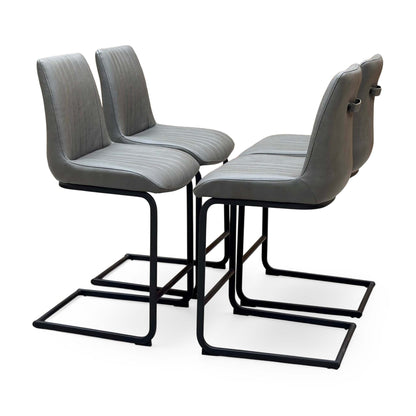 Terra grey faux leather set of 4 cantilever bar stools, angled view from the right