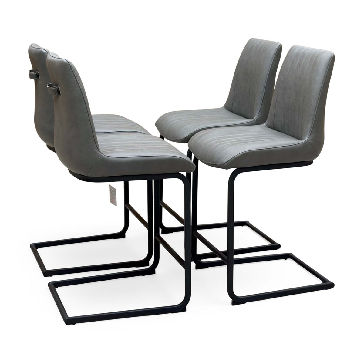 Bodahl Terra grey faux leather set of 4 cantilever bar stools, angled view with ribbed seats