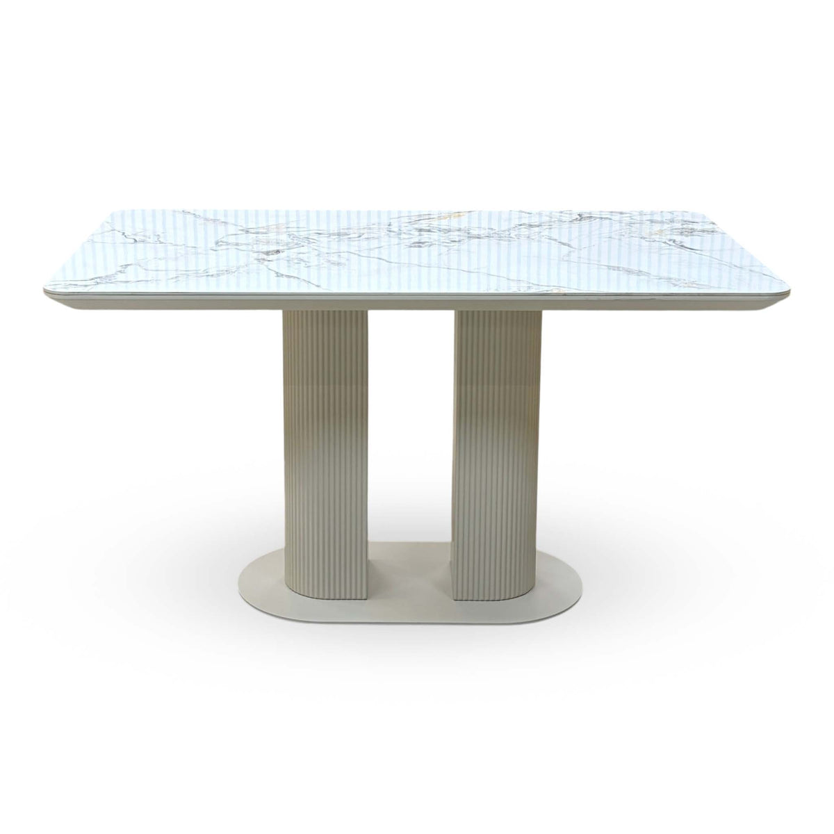 Front view of the Avorio white marble effect ceramic top fixed dining table with fluted pedestal legs