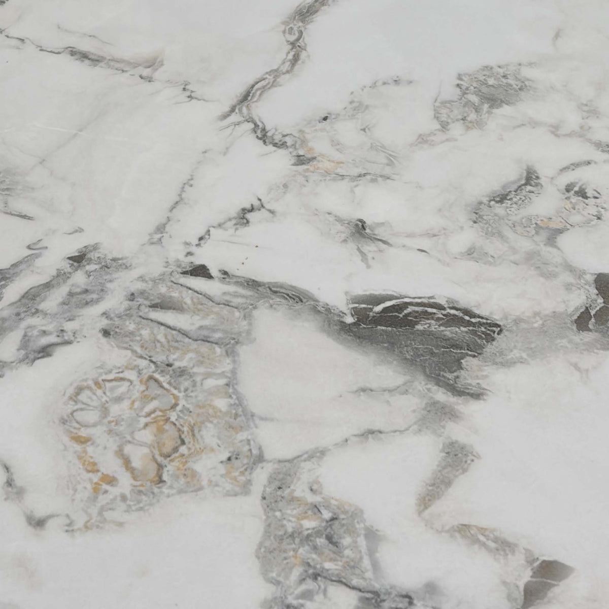 Close-up of the white and grey marble effect ceramic top used on the Avorio dining table