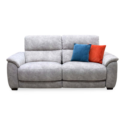 Front view of the Saffron grey velvet large 3 seater power recliner sofa with blue and orange scatter cushions