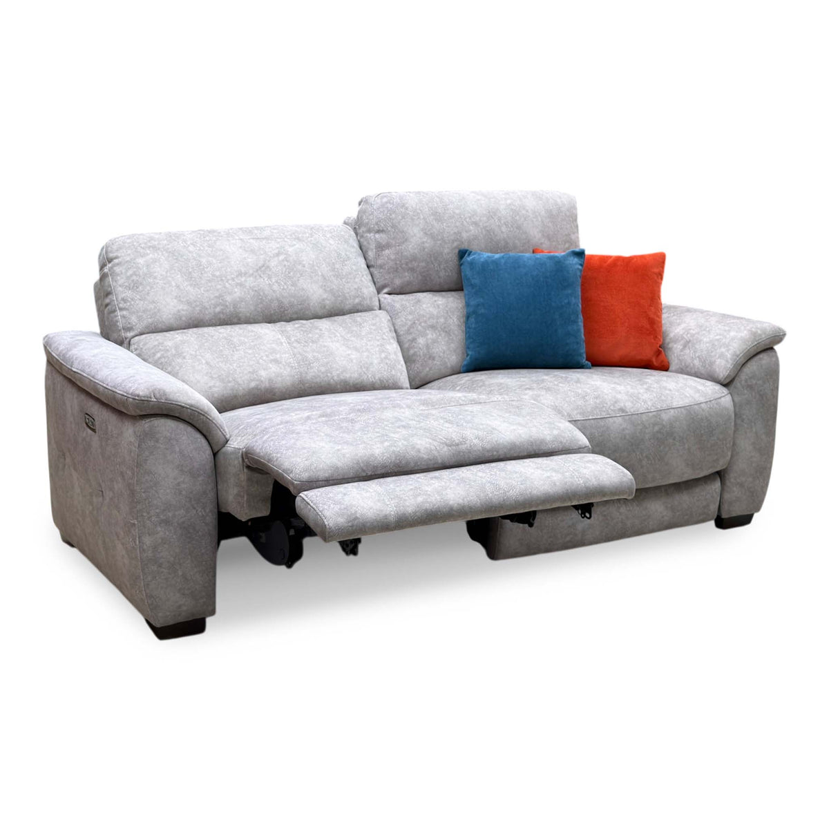 Saffron grey velvet large 3 seater power recliner sofa with the left seat reclined and blue and orange scatter cushions