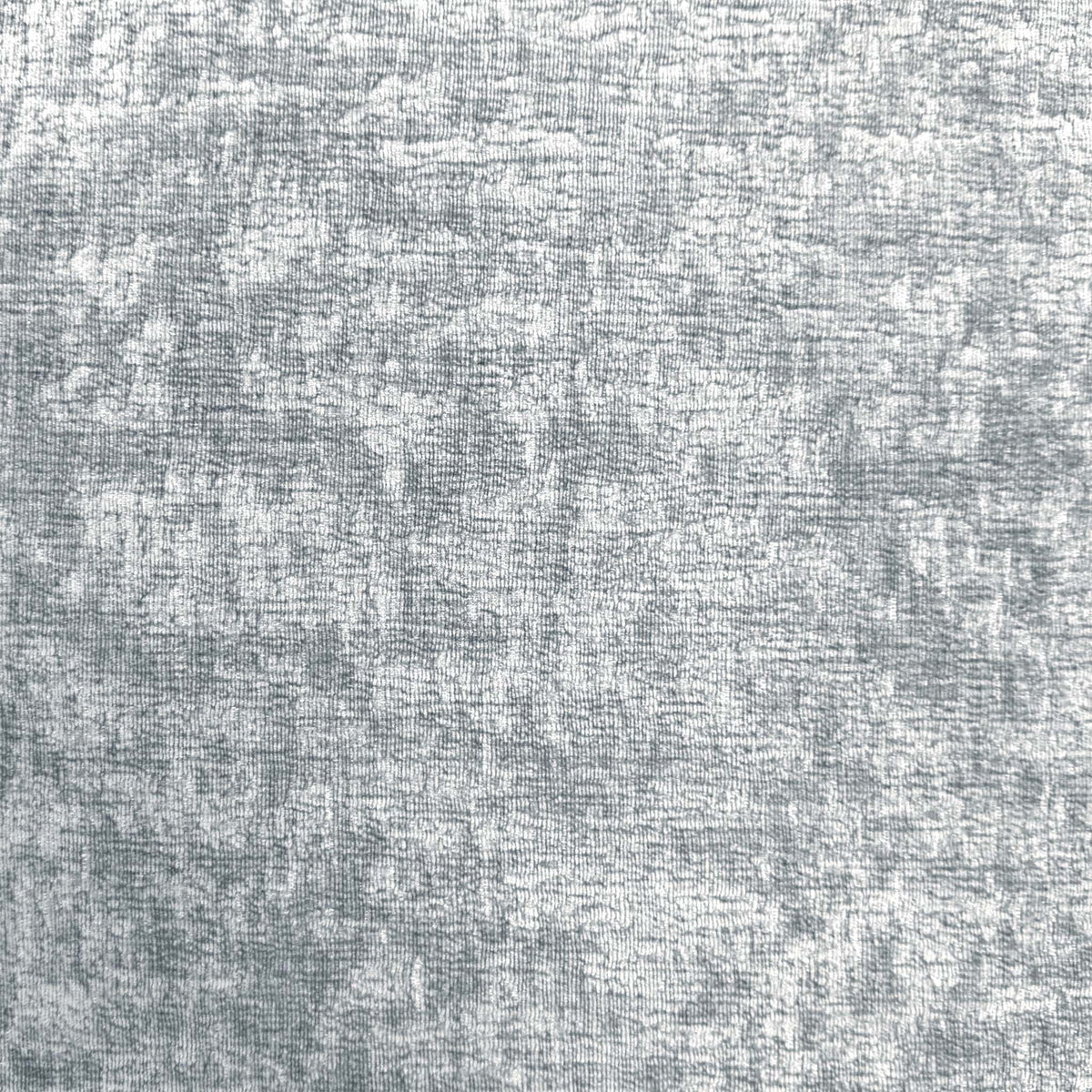 Close-up of the Denby silver textured fabric used on the Pandora storage footstool