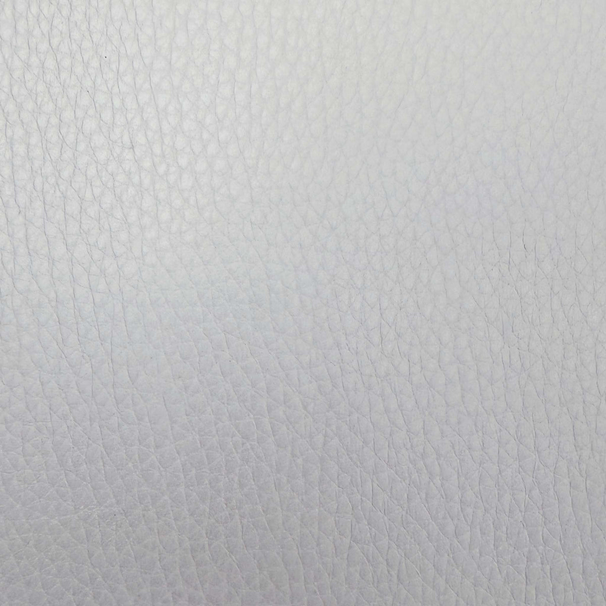 Close-up of the light grey grained leather used on the Giorgio armchair