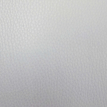 Close-up of the light grey grained leather used on the Giorgio armchair