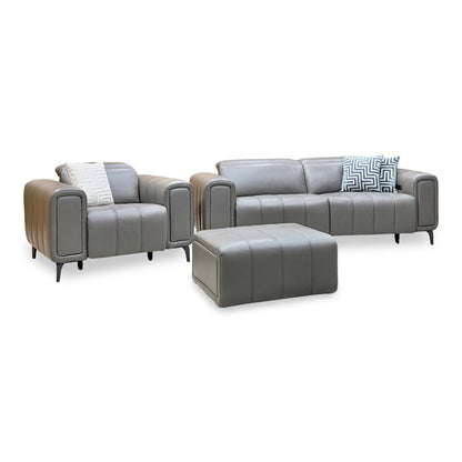 Front view of the Elphaba elephant grey leather 3 seater sofa, power chair and storage footstool with geometric cushions
