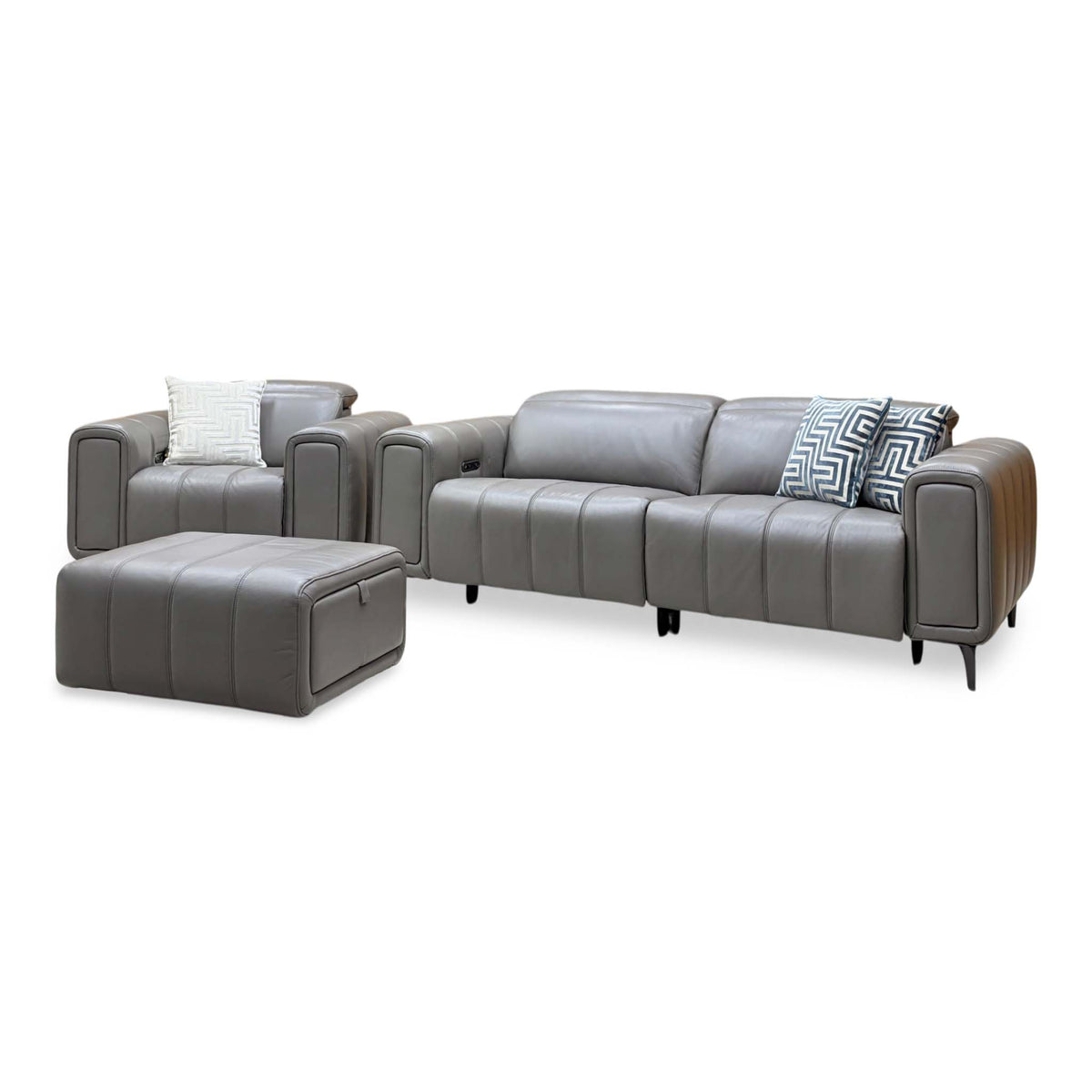 Side angle of the Elphaba elephant grey leather 3 seater sofa and power chair with the storage footstool to the left