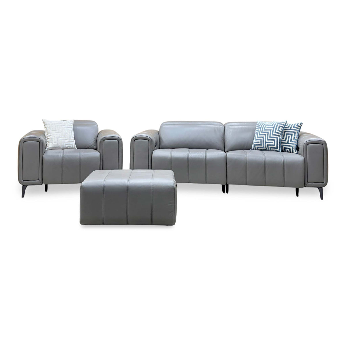 Elphaba elephant grey leather 3 seater sofa and power chair upright with the storage footstool centred in front